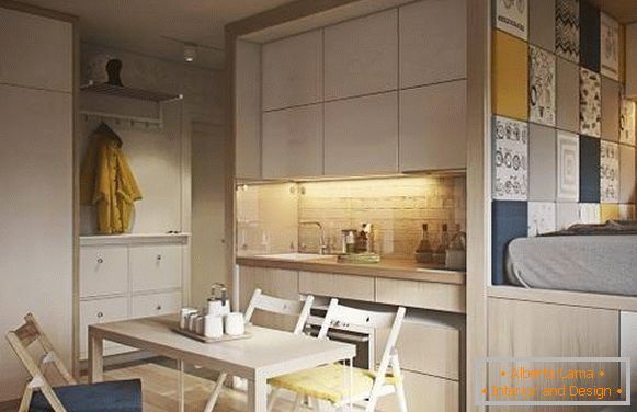 Modny design jednopokojowego mieszkania o powierzchni 40 m2 M - zdjęcie kuchni i sypialni