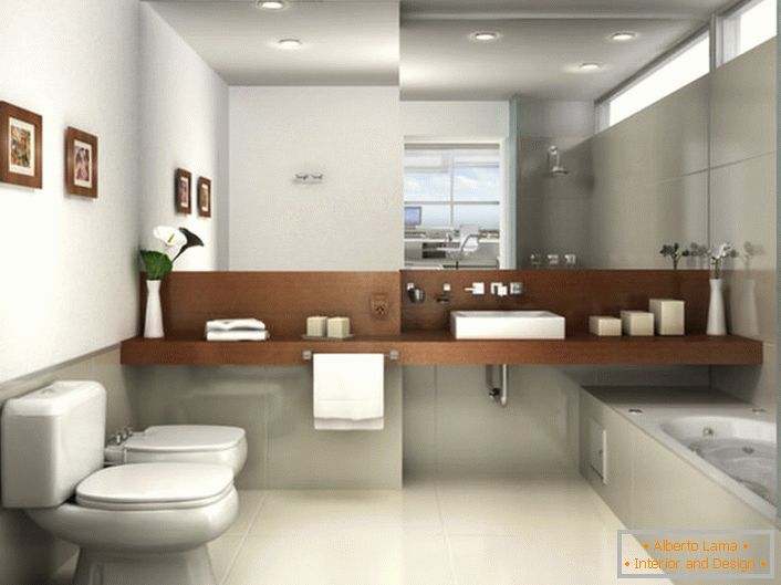 Łazienka w stylu minimalistycznym urządzona jest w jasnoszarych odcieniach. Widok przyciąga duże lustro, które zajmuje całą ścianę nad umywalką.