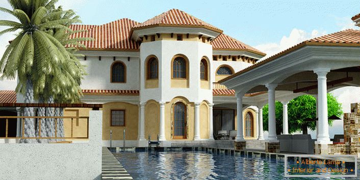 Fasada domu w stylu śródziemnomorskim wykonana jest w jasnobeżowych odcieniach. Łukowate otwory okienne są typowe dla tego stylu. 