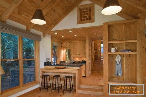 Wnętrze drewnianego domu z drewna wewnątrz - zdjęcie kuchni salonu