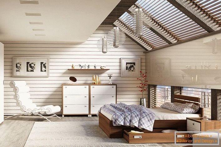 Sypialnia na poddaszu w skandynawskim stylu jest ozdobiona meblami modułowymi.