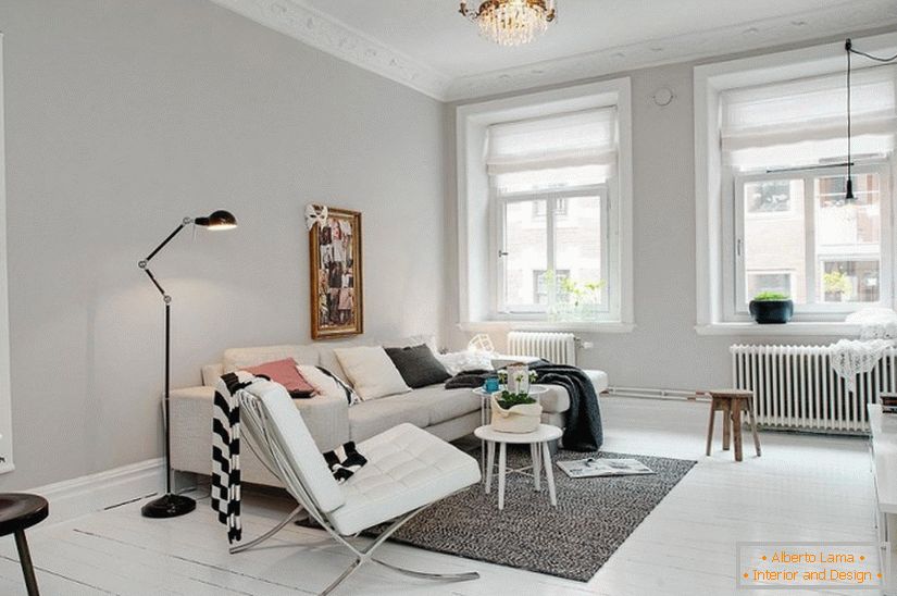 Salon apartamentu typu studio w stylu skandynawskim