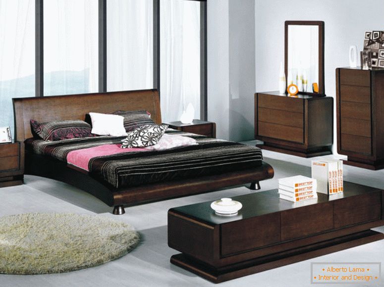 Prosta i przestronna dekoracja w sypialni z brązowymi drewnianymi meblami jak w łazience i szufladami w nowoczesnych prostych kolorach