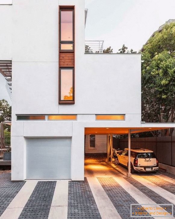 Dom w stylu minimalizmu z wiatą dla samochodów