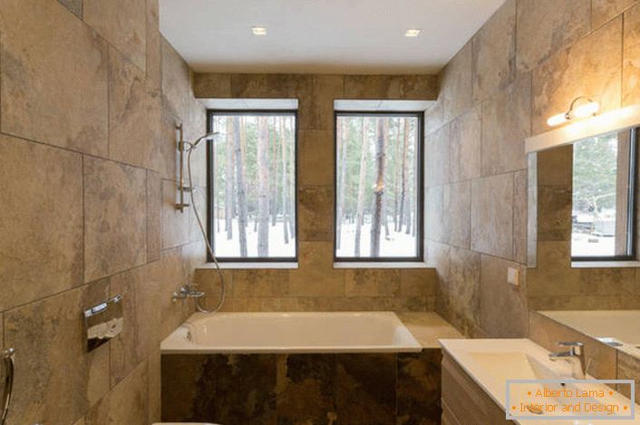 Niezwykłym rozwiązaniem do projektowania łazienki w stylu minimalistycznym jest zastosowanie do wykańczania płytek ceramicznych imitujących fakturę kamienia naturalnego.