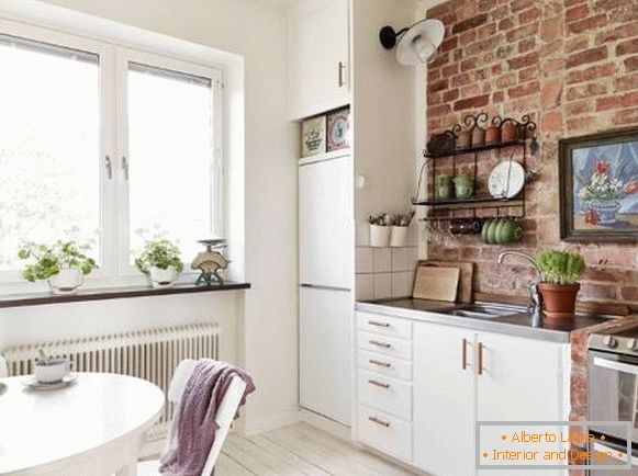 Biała kuchnia w stylu loftu z cegły - zdjęcie w Chruszczow