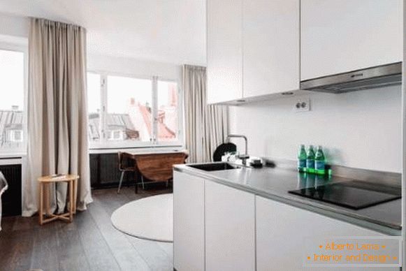 Projekt kuchni w małym apartamencie typu studio - minimalistyczne zdjęcie