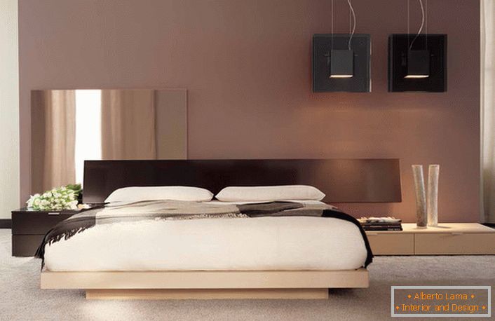 Minimalistyczny design z nutami japońskiego koloru w sypialni zwykłego francuskiego mieszkania. 
