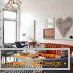 Pomarańczowa sofa i szare fotele